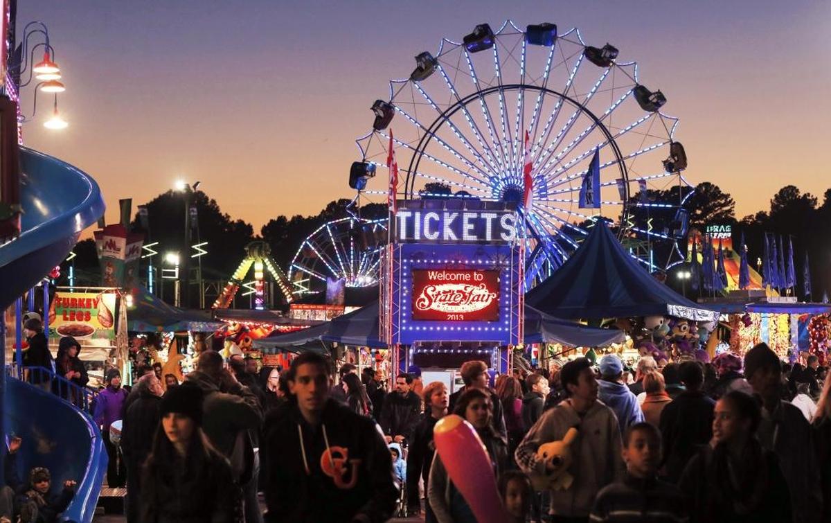 The sun sets during the N.C. State Fair Friday October 25, 2013, in Raleigh, N.C.