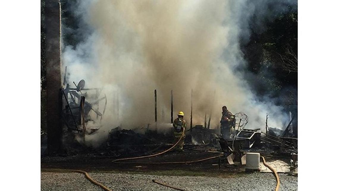 Clouds of smoke billow from the blaze that destroyed a home in Watauga County Thursday.