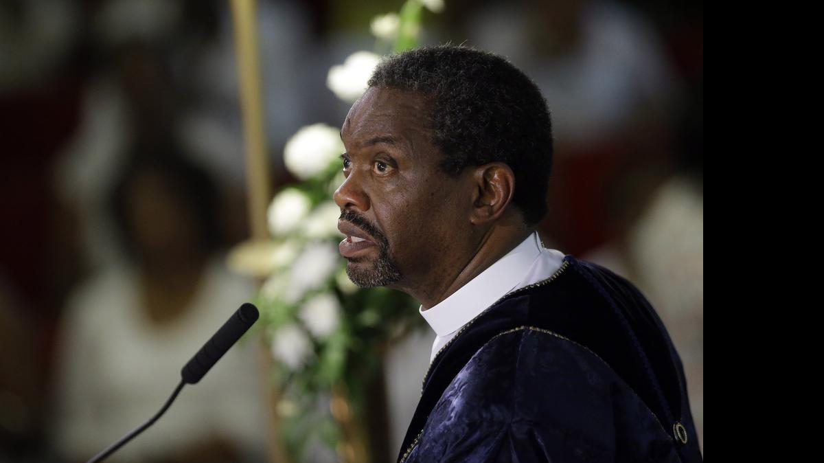 
The Rev. Norvel Goff speaks during a prayer service at the Emanuel A.M.E. Church in Charleston, S.C., four days after a mass shooting that claimed the lives of it's pastor and eight others. The 65-year-old Goff was named interim leader of the historic church called “Mother Emanuel” at one of the lowest points in its nearly 200-year history. But the Georgetown, South Carolina, native says the church won’t dwell on the past.
