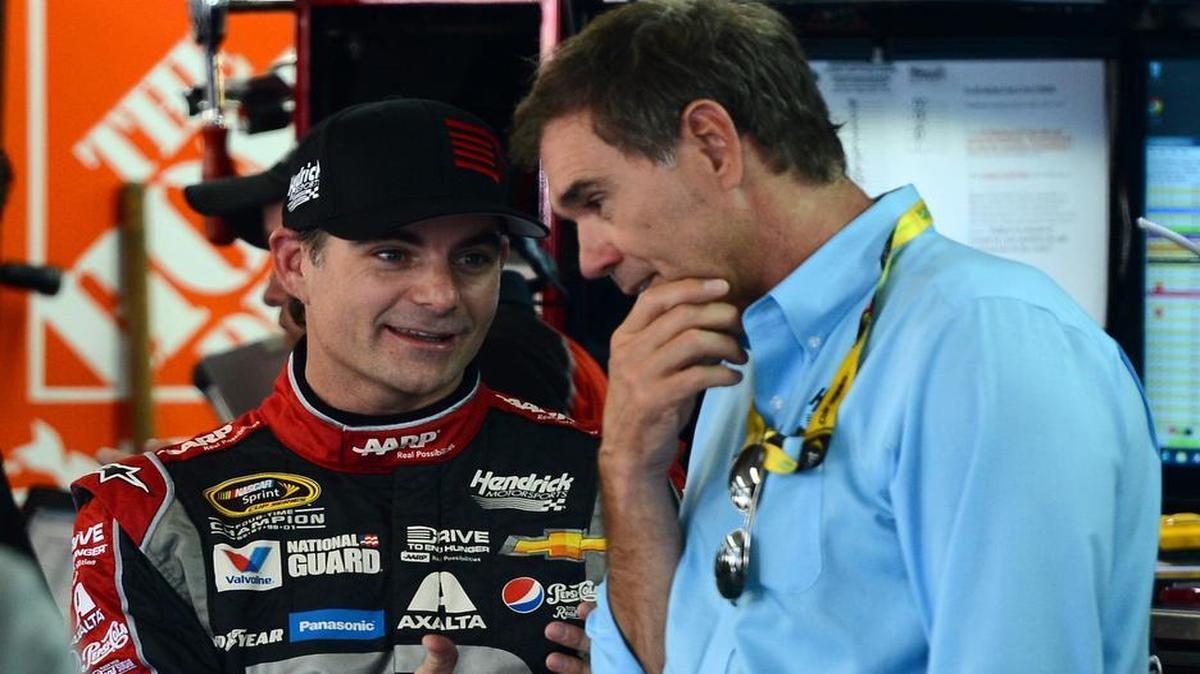 
NASCAR Sprint Cup Series driver Jeff Gordon (24) talks with Ray Evernham as adjustments are made to his car during practice at Charlotte Motor Speedway on October 9, 2014.
