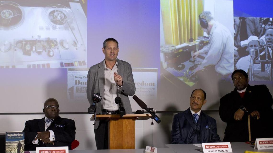 
N.C. State University English professor W. Jason Miller, center, speaks alongside of Tolokun Omokunde, left, Herbert Tillman, second from right, and Rev. William Barber, right, during a press event that revealed audio from Rev. Martin Luther King Jr.'s 1962 Rocky Mount speech Tuesday, August 11, 2015 at the James B. Hunt Jr. Library in Raleigh, N.C.
