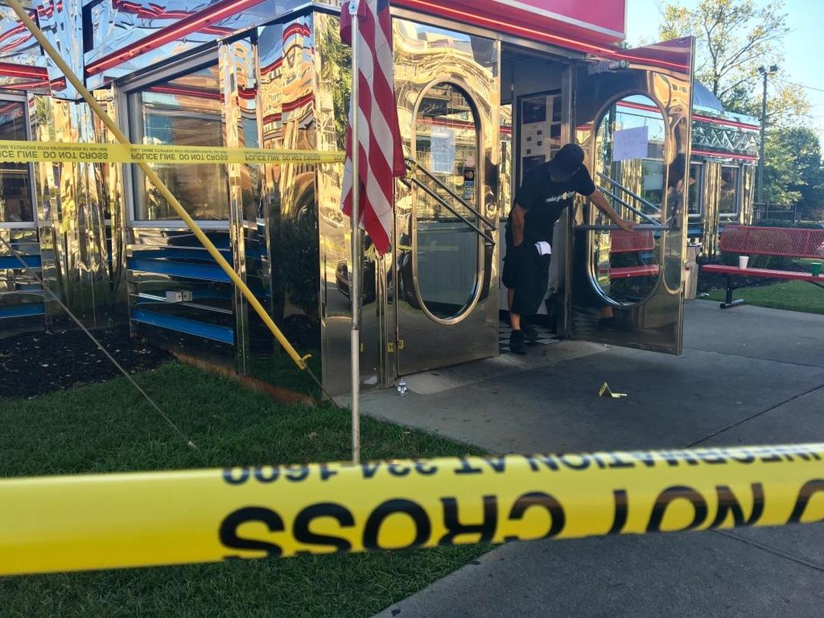 Crime Scene tape surrounds the Midnight Diner Monday morning, after a shooting outside the building.