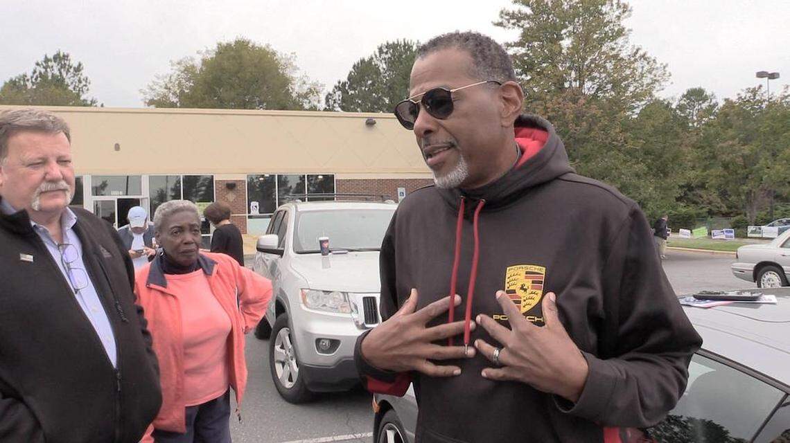 Derek Partee, a retired New York police detective and GOP volunteer campaign worker, talks on Thursday about the threatening incident outside a Steele Creek early voting station the day before.