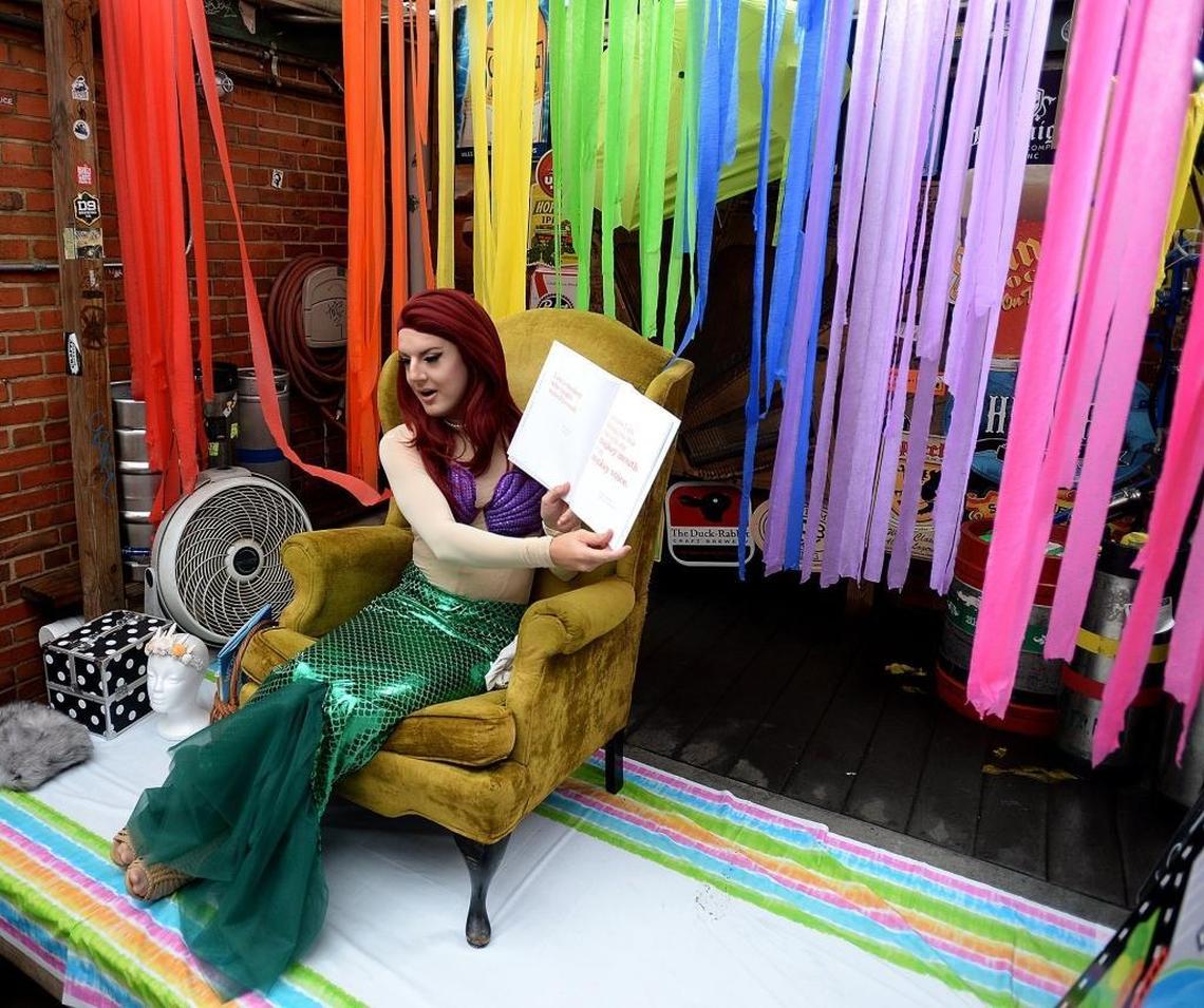 Brandon James reads books to a large crowd during story time Saturday at Common Market.