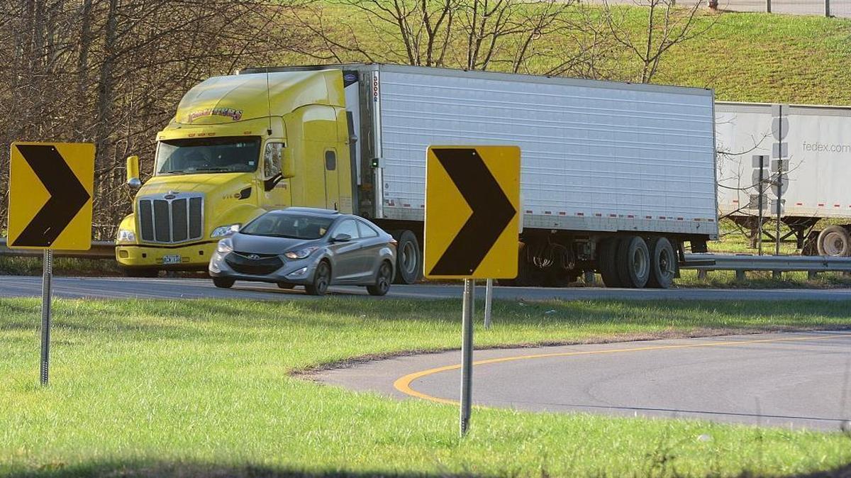 A trucker parks his rig along the shoulder of a southbound exit ramp on I-74 in Surry County, where interstate truckers frequently receive tickets for roadside napping from the NC Highway Patrol.