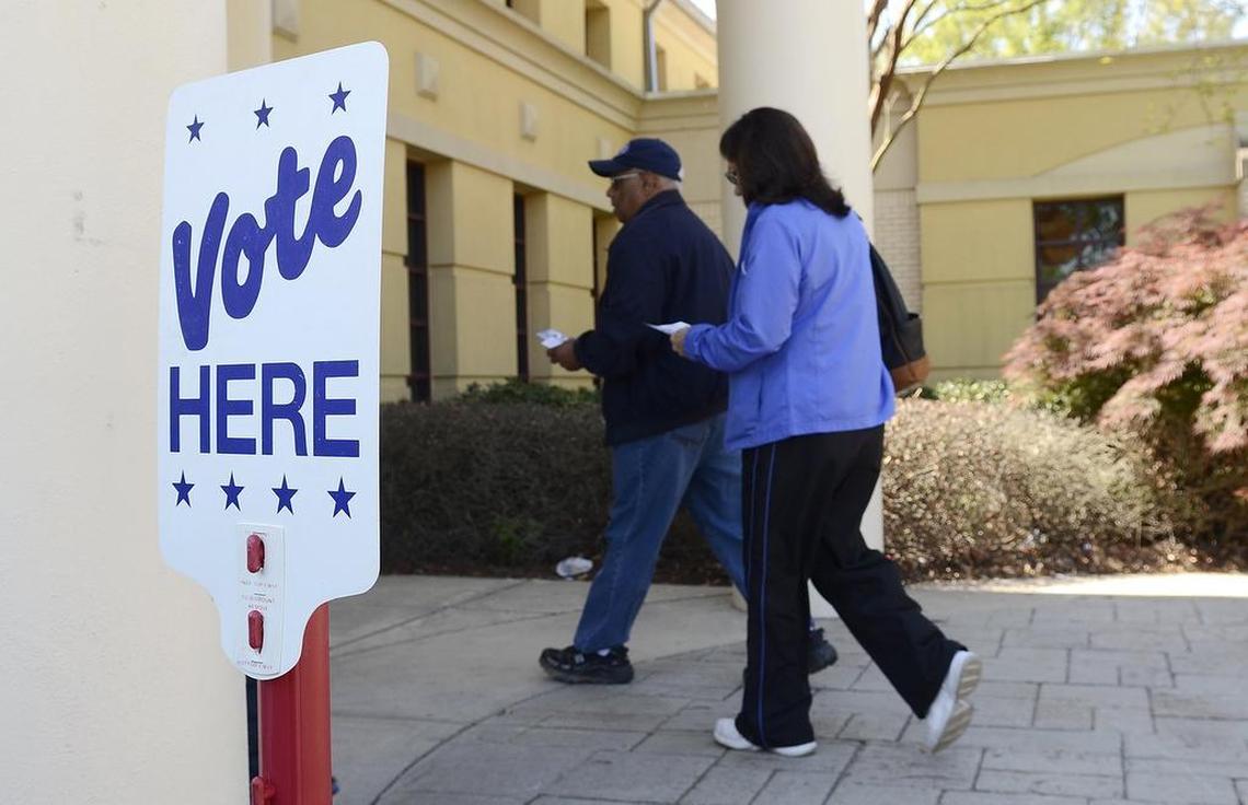 Voters enter a Charlotte polling place in June 2024.