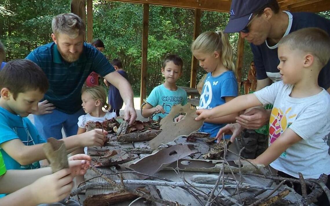 Kids test skills at bark-boat building
