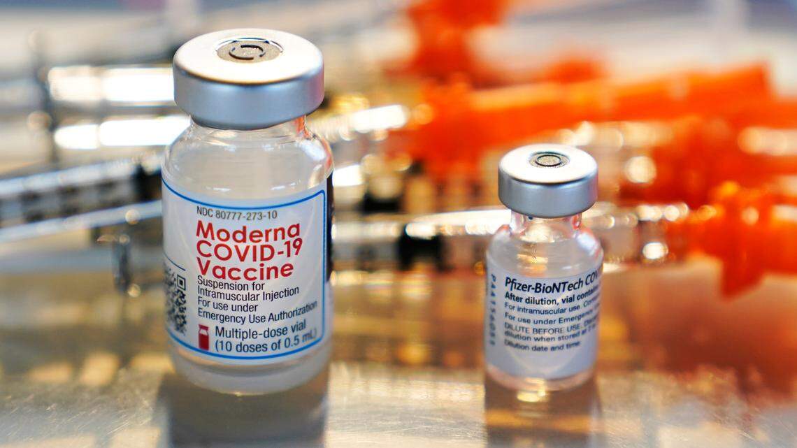 FILE - In this Feb. 25, 2021, file photo, vials for the Moderna and Pfizer COVID-19 vaccines are displayed on a tray at a clinic. Pasadena officials canceled a COVID-19 vaccination clinic after ineligible people, including Hollywood and media workers, claimed 900 out of the 1,500 slots.(AP Photo/Charles Krupa, File)
