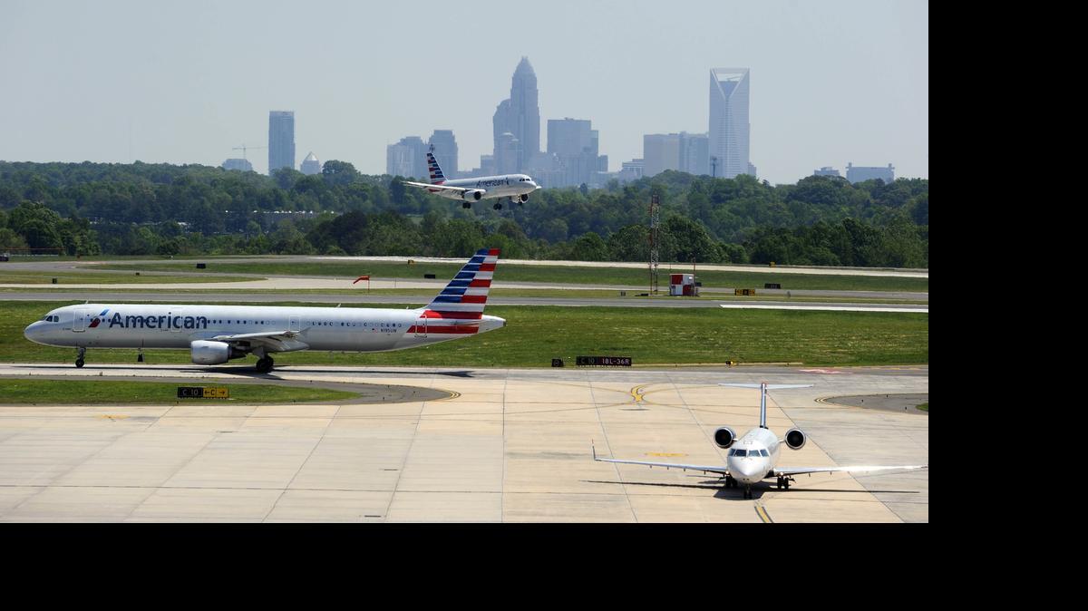 
A view from atop the new Hourly Deck and Consolidated Rental Car Facility at Charlotte Douglas International Airport as airplanes land and prepare to take off, on Monday, May 4, 2015. 
