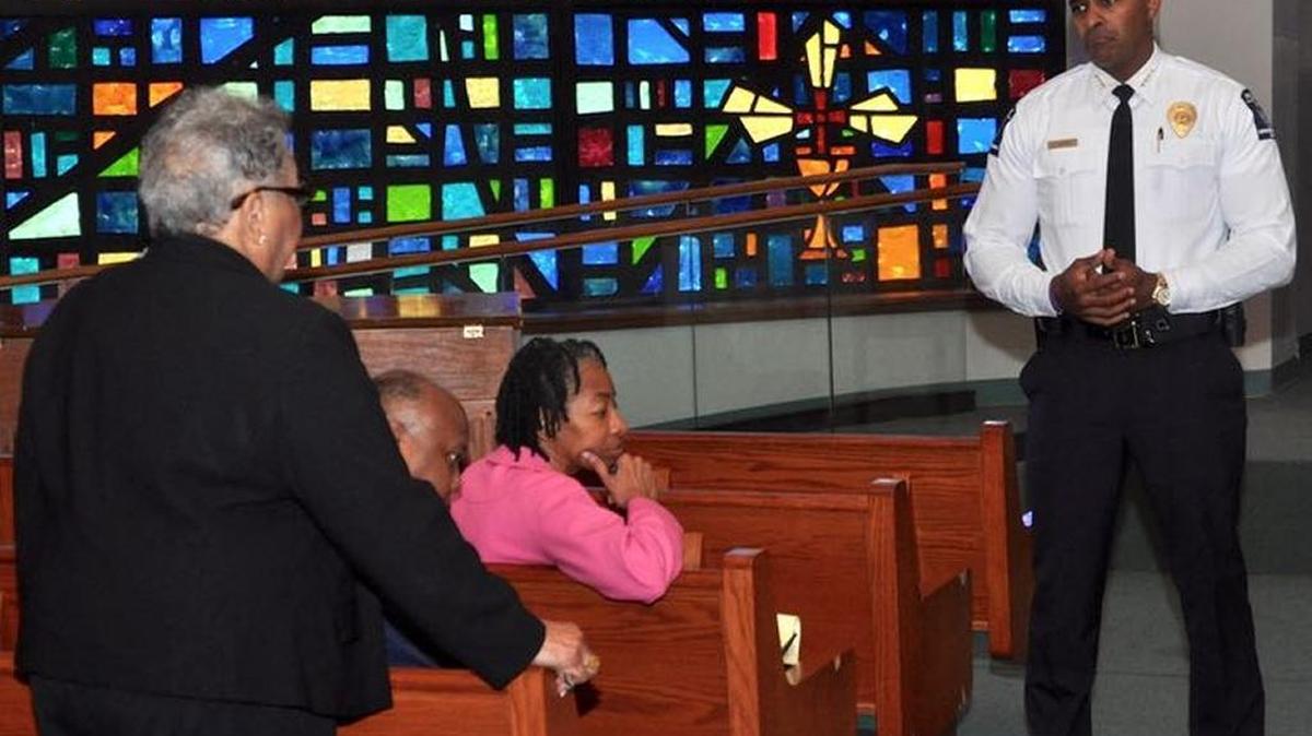 CMPD Chief Kerr Putney listens to Mecklenburg Commissioner Vilma Leake during a community meeting at First Baptist Church-West to discuss the April 17 arrest of West Charlotte band director Duncan Gray. Gray, accused of taking indecent liberties with a minor, was taken into custody during Sunday worship at Friendship Missionary Baptist Church.