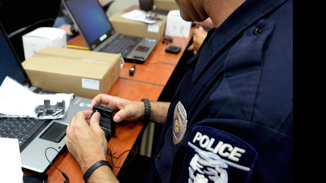 
CMPD officers get a first look at their body cameras during a training class at the Metro Division headquarters. Police officers with the city's Metro Division will begin wearing body cameras Wednesday as state legislators continue debate whether the recordings should be public record.
