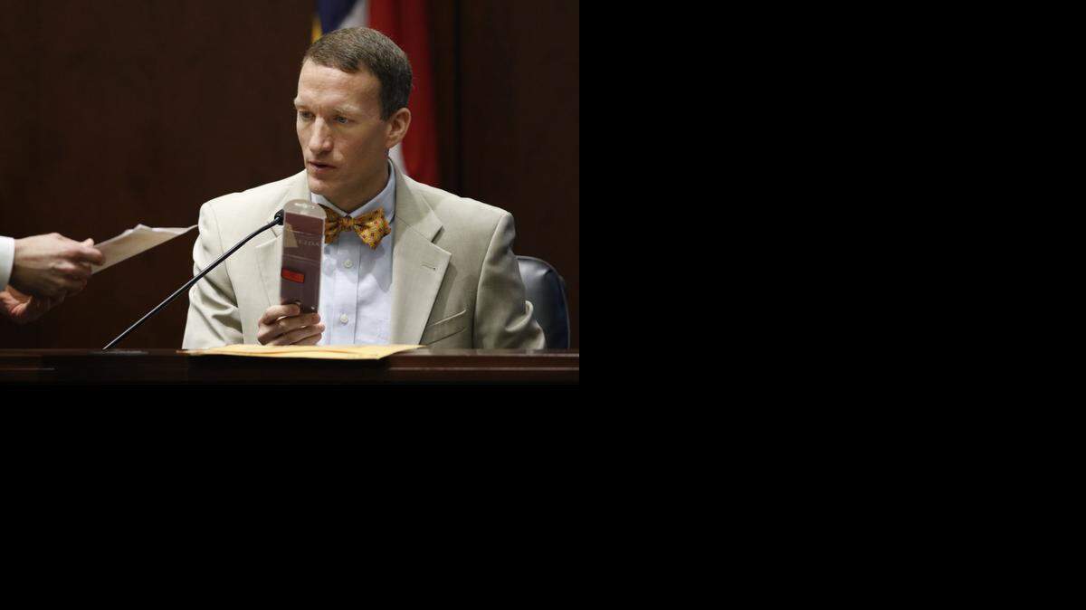 
Raleigh Police Detective Zeke Morse identifies the plastic packaging wrapper to an Oneida chef’s knife found in a backpack belonging to defendant Jonathan Broyhill at the Nation Hahn home in April 2013 as he testifies Thursday in Wake Superior Court. Thursday was the seventh day of testimony in the Jonathan Broyhill murder trial.
