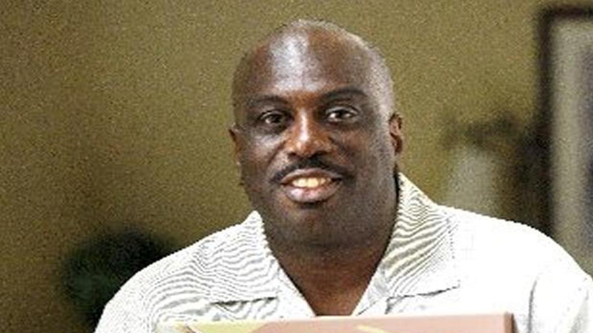 Malcolm Graham of Charlotte holds a portrait of his sister, Cynthia Hurd – one of nine members of an African American church in Charleston gunned down on June 17, 2015. On Wednesday, the murder trial of accused killer and white supremacist Dylann Roof begins. Graham says he will be in courtroom in behalf of his sister and the fight against racism and violence.
