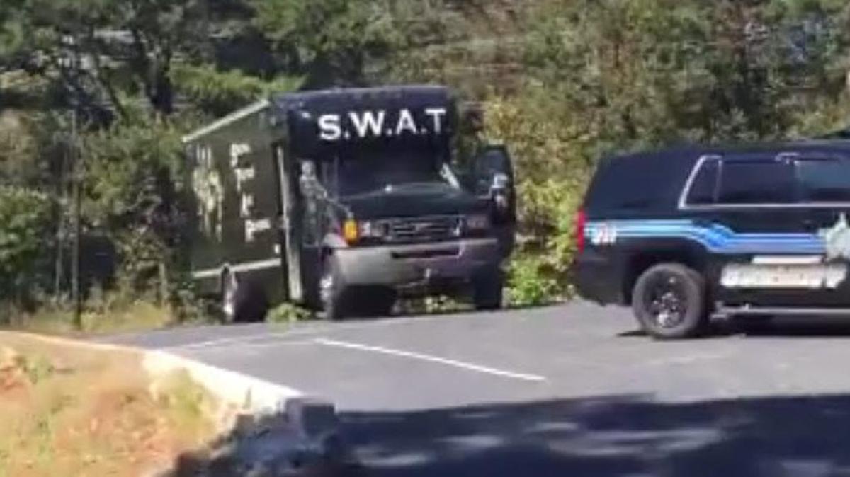 A driver in a stolen pickup truck poured gasoline on himself as an officer approached, leading to a standoff south of Hickory on Monday afternoon.