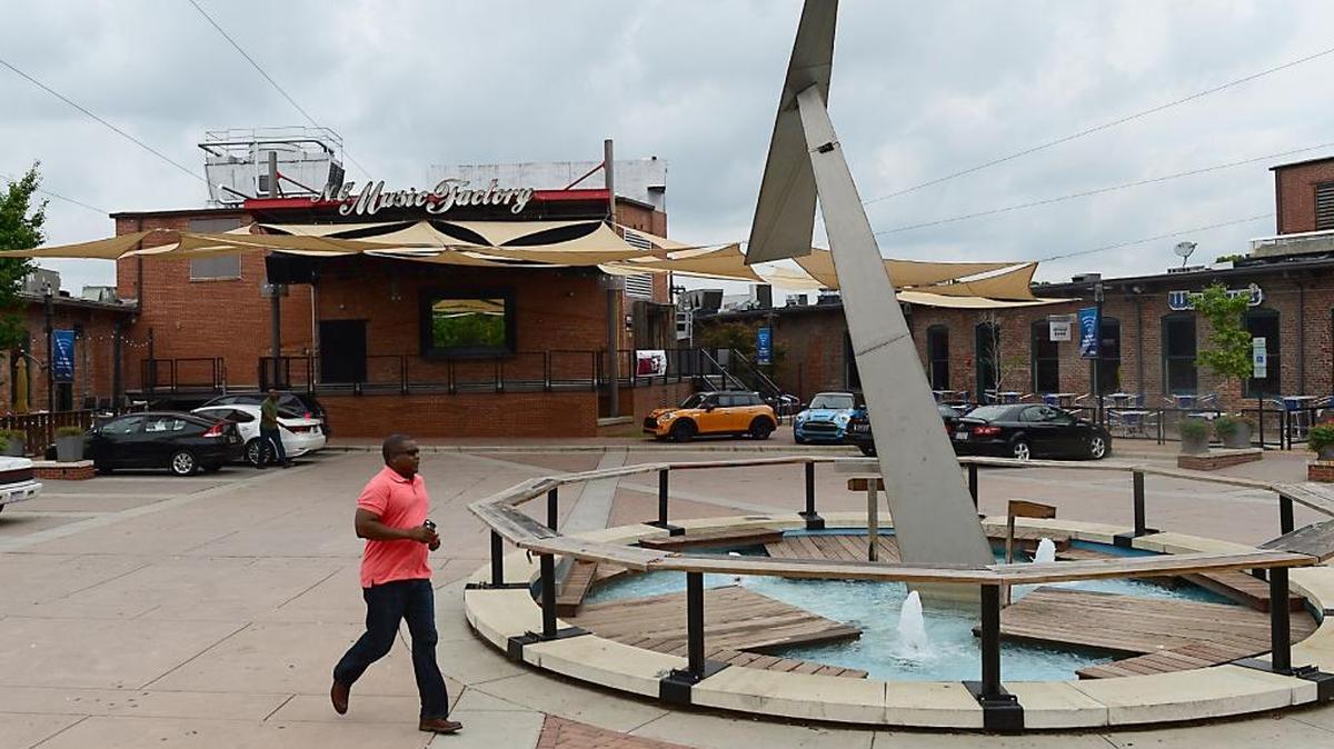 
Patrons make their way into the NC Music Factory in uptown Charlotte Saturday. Three teens have been arrested following a late-night shooting that injured five at the popular venue.
