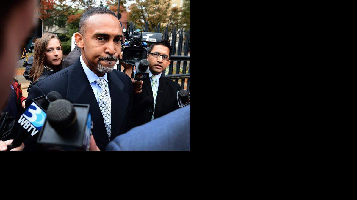 
Former Charlotte Mayor Patrick Cannon, center, surrounded by the media, arrives at the federal courthouse Nov. 6, 2014. Four pieces of FBI surveillance video show Cannon accepting money from undercover federal agents, WBTV said.


