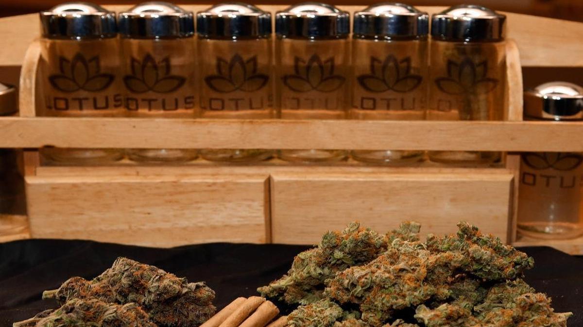 FILE - In this April 24, 2013, file photo, A 1/4 ounce, left, and one ounce of marijuana are displayed along with a handful of joints at a dispensary in Denver. An Observer review of CMPD arrest records, as well as more than 20,000 N.C. court records, shows that over the last two years, Charlotte police arrested blacks found with less than a half-ounce of marijuana at about three times the rate of whites, or 28 percent to 10 percent.