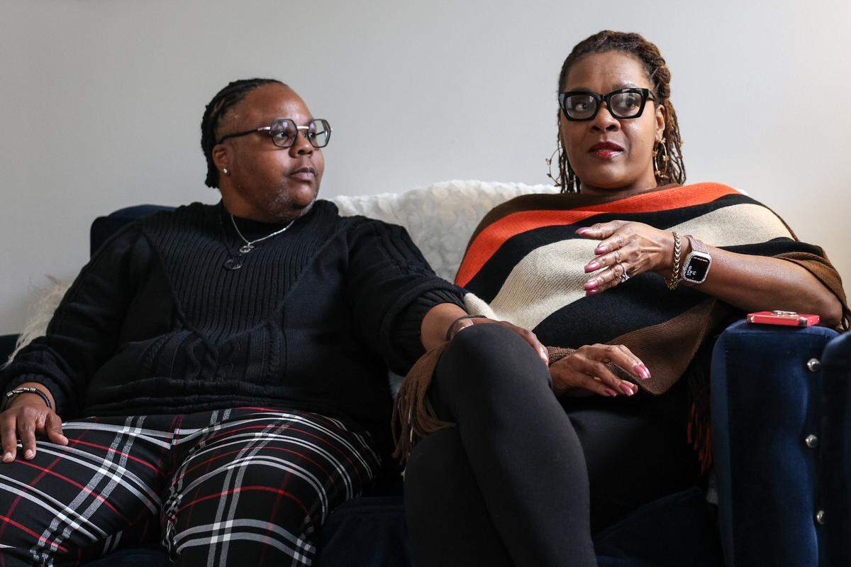 Shann Fulton places a comforting hand on the leg of their fiancee, Michele Edwards, as she explains the painful details of how their dream wedding crumbled as their venue went into foreclosure just months before they were to be married.