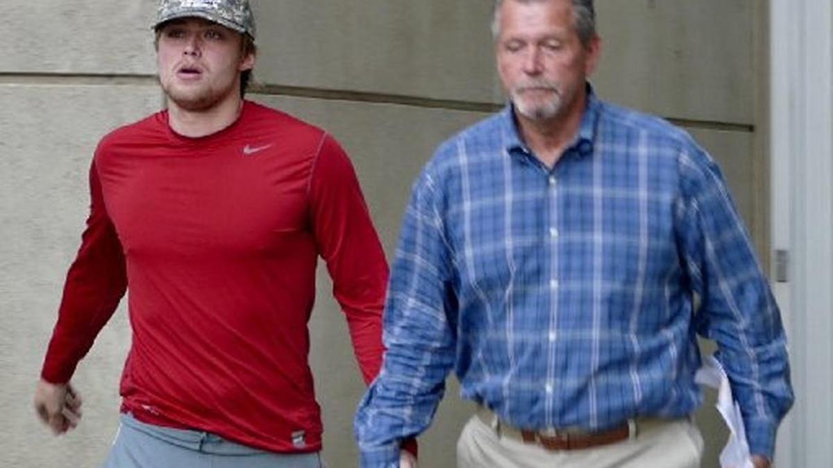UNC Charlotte quarterback Kevin Olsen leaves the Mecklenburg jail in February with his father after being charged with second-degree rape and other crimes. The case against Olsen, the younger brother of Panthers tight end Greg Olsen, goes before a Mecklenburg grand jury on Monday.