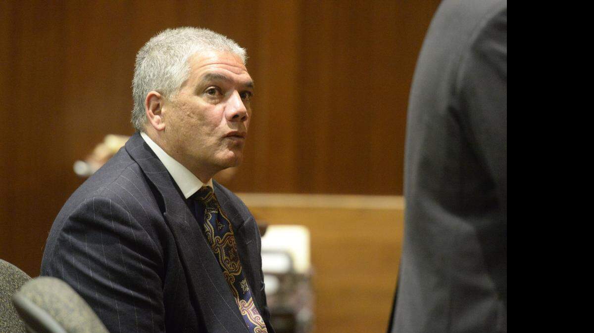 
Damon Mallatere listens as his attorney addresses the judge during a 2014 court hearing in Boone. 
