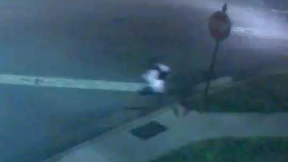 A passerby with a gun fired a shot at a man trying to rob another person at a gas station in Cornelius. Police released this blurry video of the robber running away.
