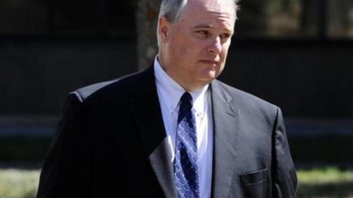 Wayne Parker, the former headmaster of Southlake Christian Academy in Huntersville accused of stealing $9 million from the school, walks to the Charles R. Jonas Federal Courthouse on Thursday, in July. He was sentenced to five years in prison Wednesday.