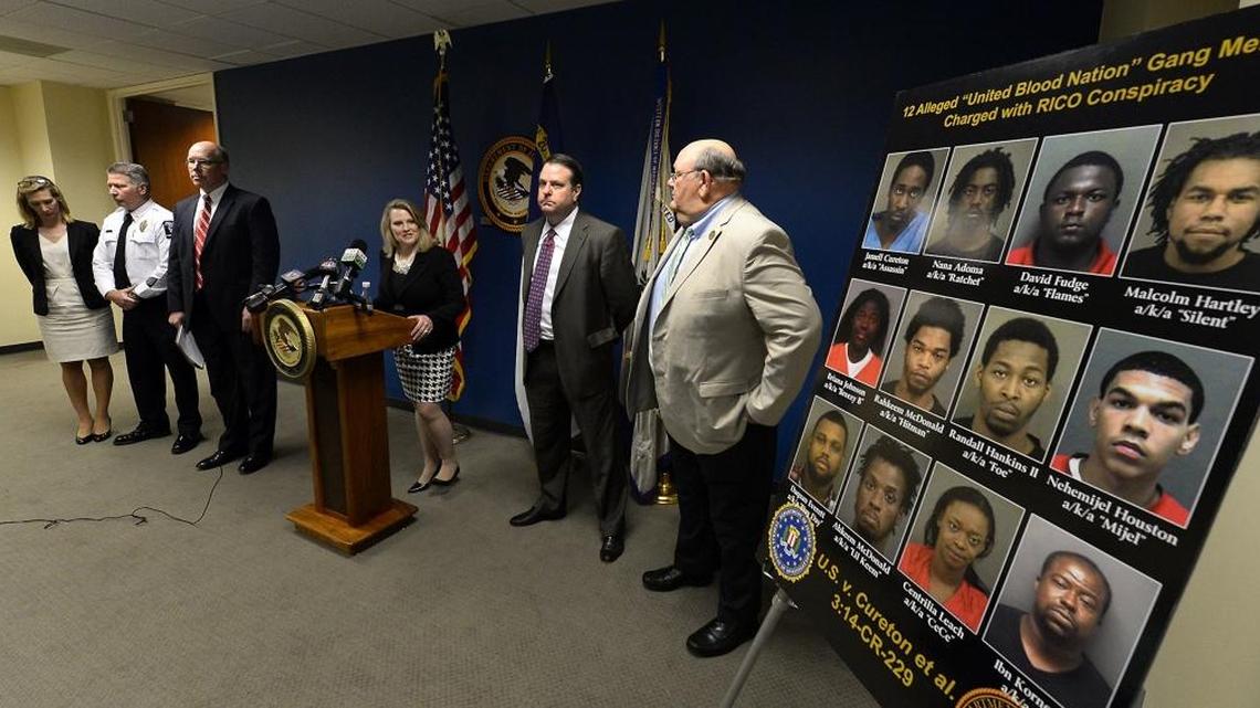 U.S. Attorney Jill Rose and other federal, state and local officials announce the arrests of a dozen United Blood Nation members from Charlotte connected to the killing of Doug and Debbie London in 2014.