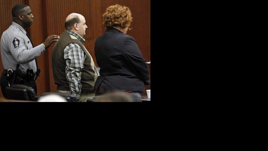 
From left, Wake Sheriff’s Deputy T.V. Edwards prepares to escort Jonathan Broyhill out of court Thursday after Broyhill was sentened to life in prison in the murder of Jamie K. Hahn in April 2013. Defense attorney Caroline Elliot stands at right. 
