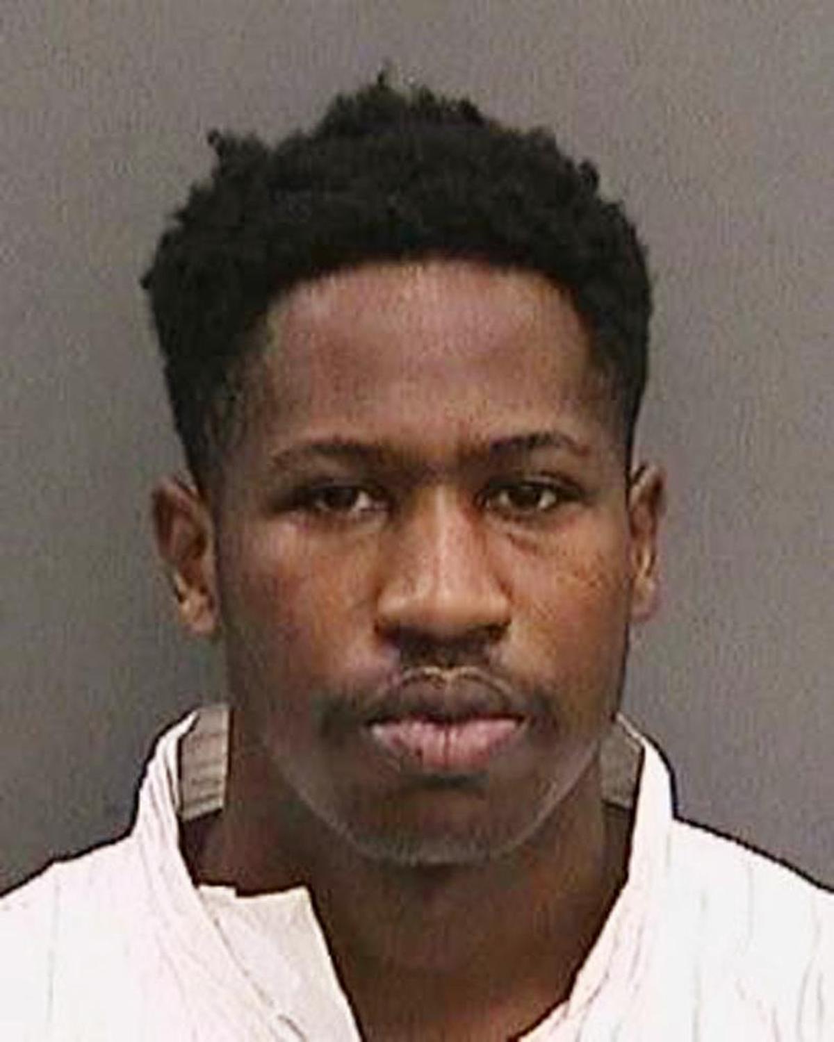 Howell Emanuel Donaldson III, the suspect in a string of four slayings that terrorized a Tampa neighborhood was arrested after he brought a loaded gun to his job at a McDonald's and asked a co-worker to hold it, authorities said. (Tampa Police Department via AP)