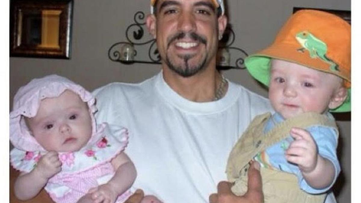 Scott Coffey, who was killed in Charlotte in October, was a devoted dad to his three kids, his sister Brandi Williams said. In this family photo, Coffey holds twins Kyra, left, and Riley.