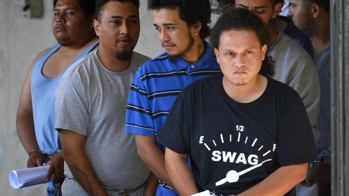 Gang members leave the Federal courthouse in Charlotte after a major round-up. Federal authorities charged 37 suspected MS-13 gang members Wednesday. May 20, 2015, with racketeering and other charges in connection with a series of murders.