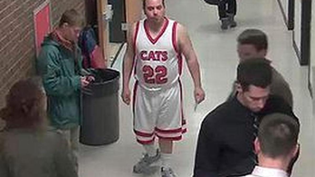 Security footage taken in February 2012 at Century High School in Bismarck, N.D., shows a man in a jersey identified as Sherwin Shayegan of Bothell, Wash., known as the ‘piggyback bandit.’