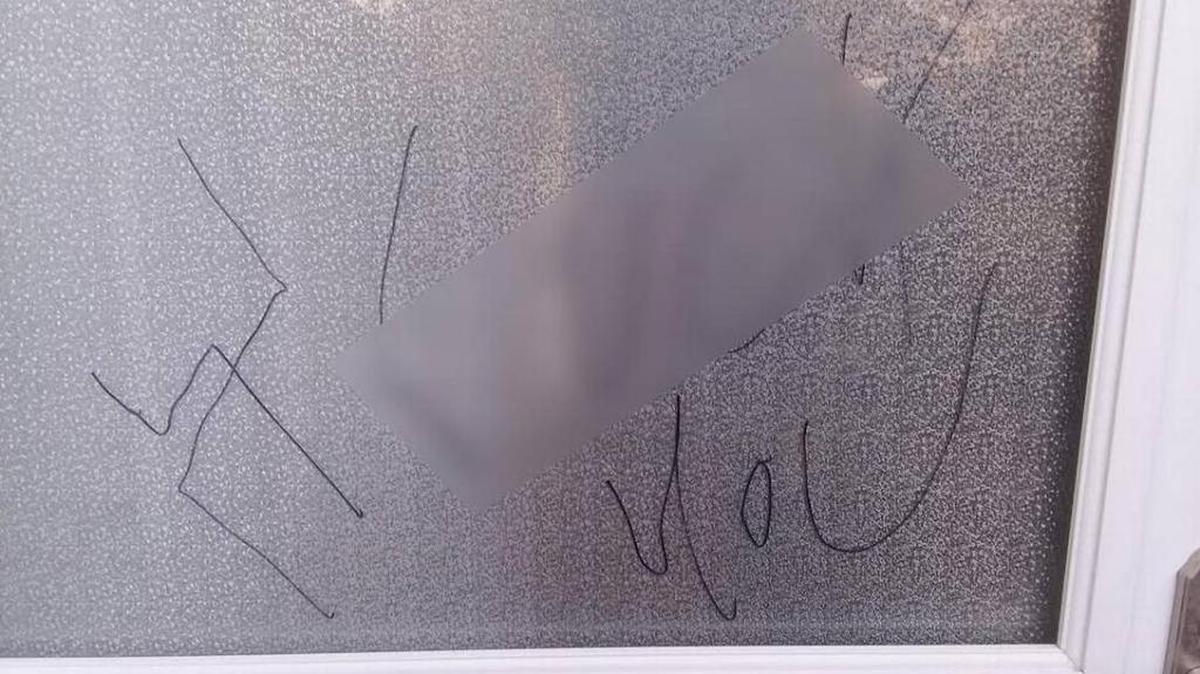A couple in southwest Charlotte returned home after a Rosh Hashanah event to find a swastika and profanity written on their door. The profanity has been blurred out by the Observer.