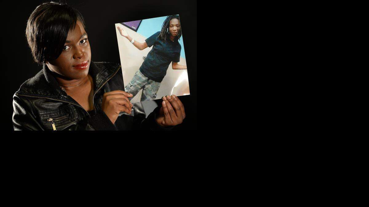 
 Korneisha Banks, holds a photo of her girlfriend, Janisha Fonville, 20, who was fatally shot by a CMPD officer. Banks disputes the police account of the shooting.
