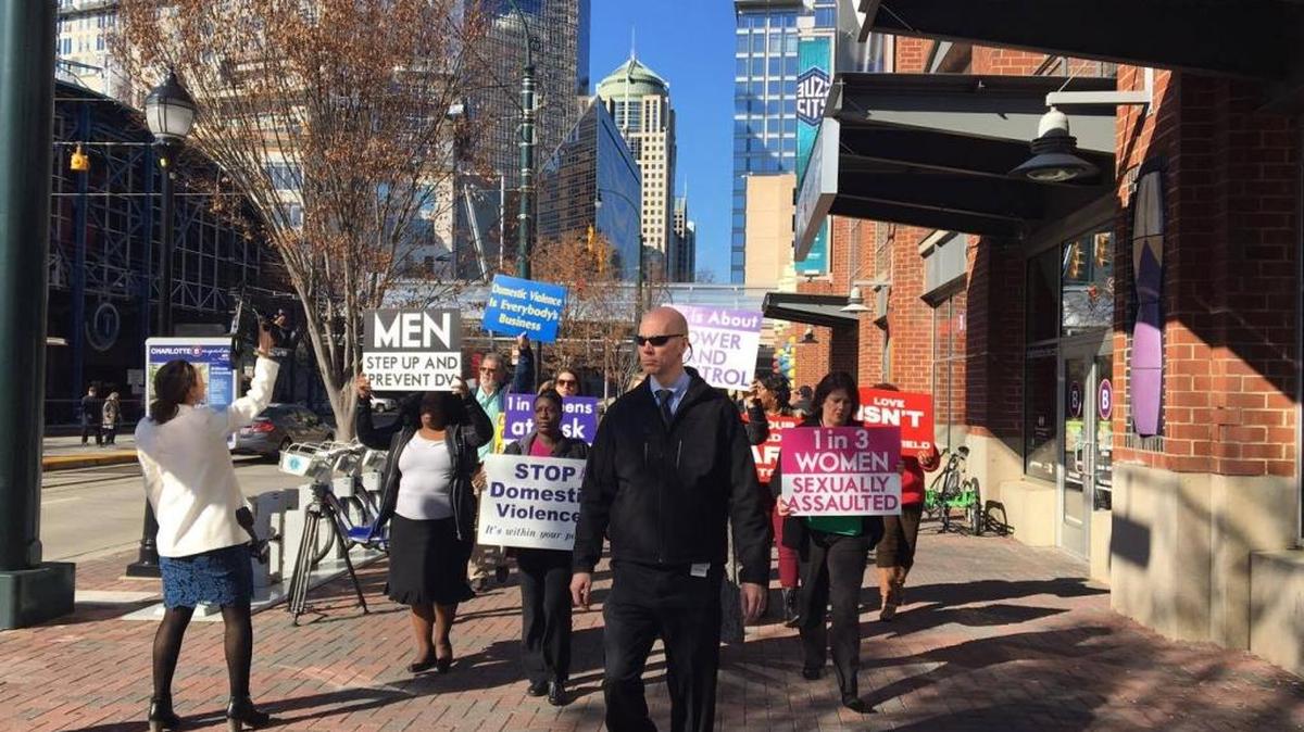Sgt. Craig Varnum walked ahead of a march remembering Daphne Ellis, one of nine people who died in domestic violence cases in Charlotte in 2016. Varnum leads CMPD’s domestic violence unit.