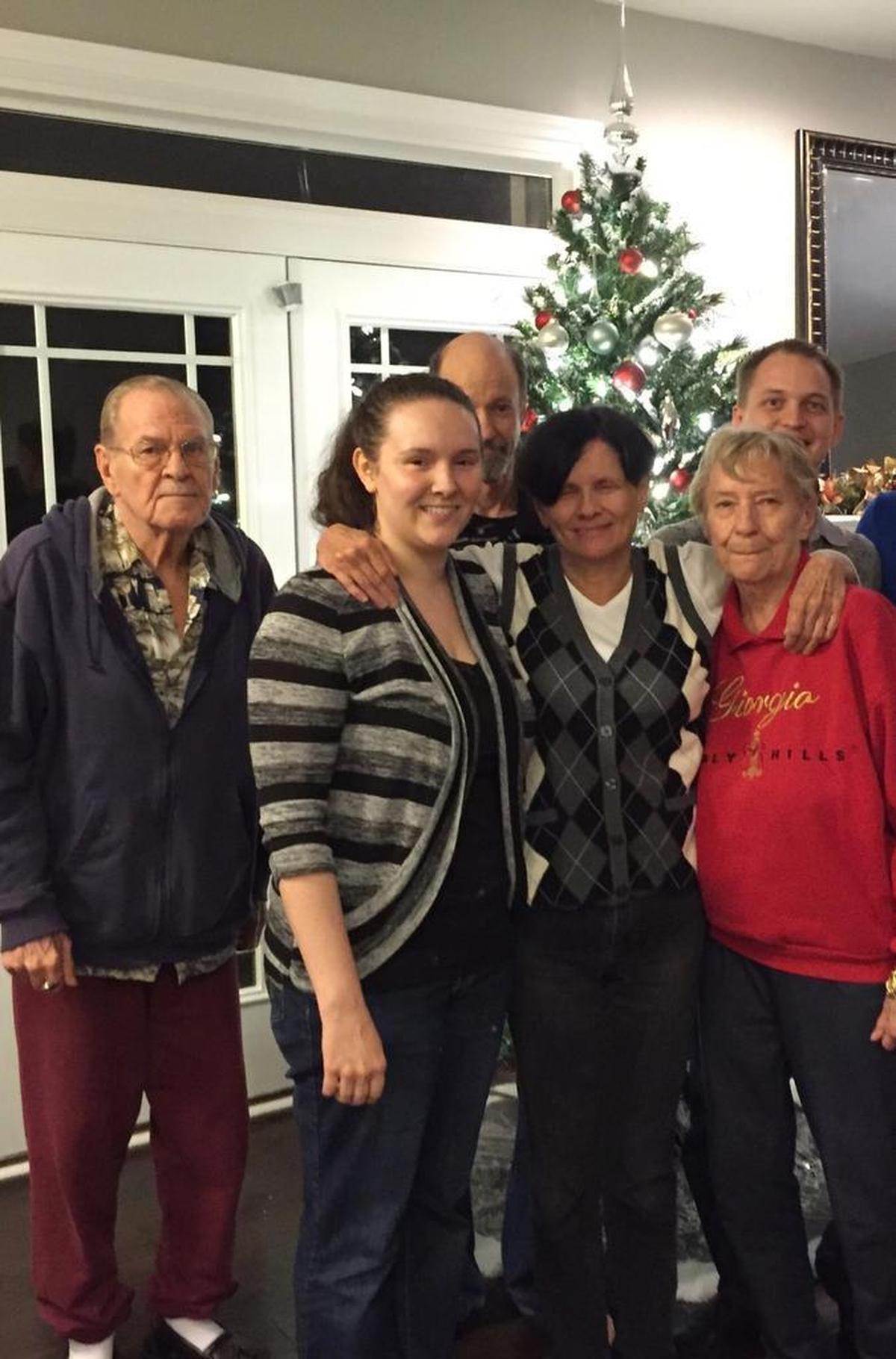 Jim Norris, far left, and wife Charlene, front right, appear in a Christmas photo with family members about two years ago. On June 9, 2016, Jim told Charlotte-Mecklenburg police that he shot Charlene as part of a suicide pact due to their failing health. Jim didn’t shoot himself, and now he’s charged with first-degree murder