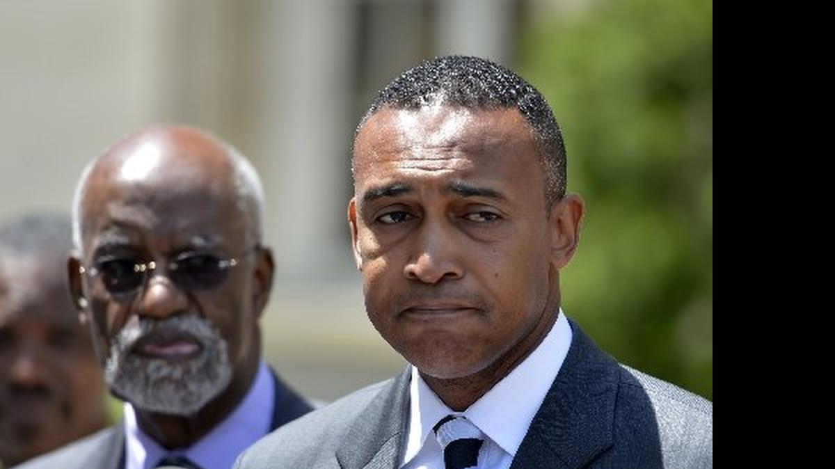 
Former Charlotte Mayor Patrick Cannon speaks to reporters after pleading guilty to corruption charges in June 2014. The federal judge in his case has agreed to release some documents he considered in sentencing Cannon to 44 months.
