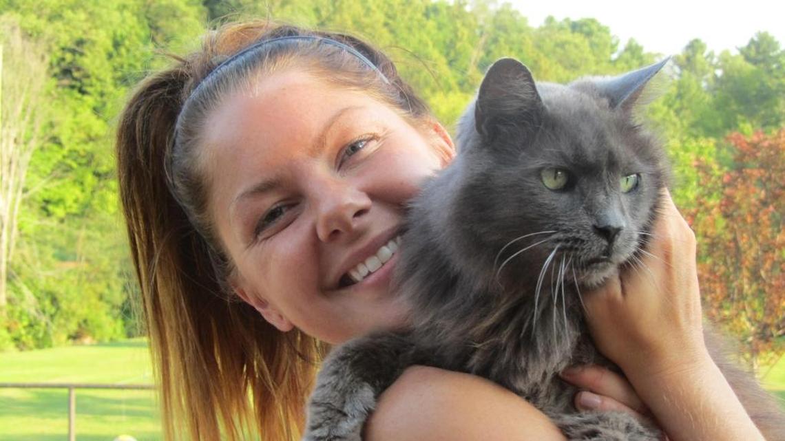 Kelli Putnam at home in New York in August with her cat, Bailey.