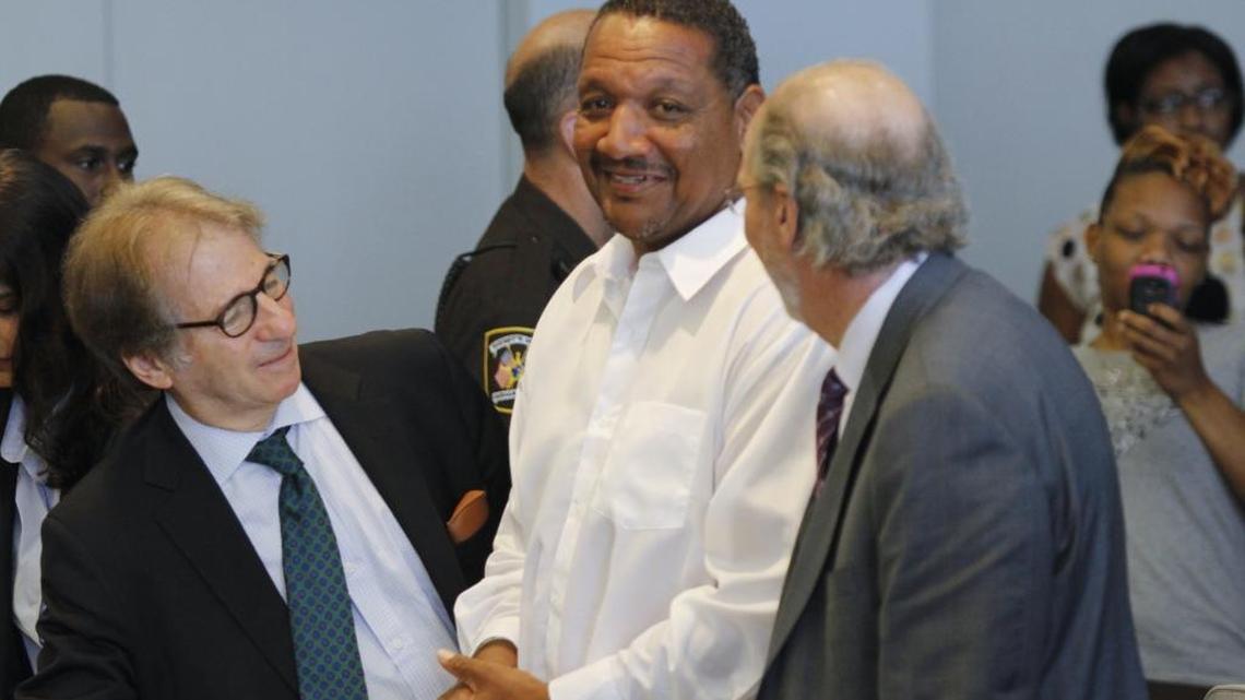 
Innocence Project defense attorneys Barry Scheck, left, and James Cooney III, right, were happy for their client Darryl Howard when a judge ordered a new trial in 2014.
