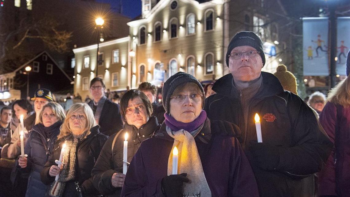 People attend a vigil for victims of a Jan. 29 shooting at a mosque in Quebec City.