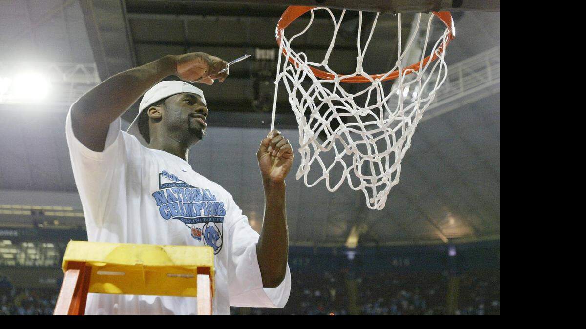 
 North Carolina’s Melvin Scott  cuts down the net after the Tar Heels defeated Illinois 75-70 to win the NCAA men's basketball national championship game, April 4, 2005 in St. Louis.
