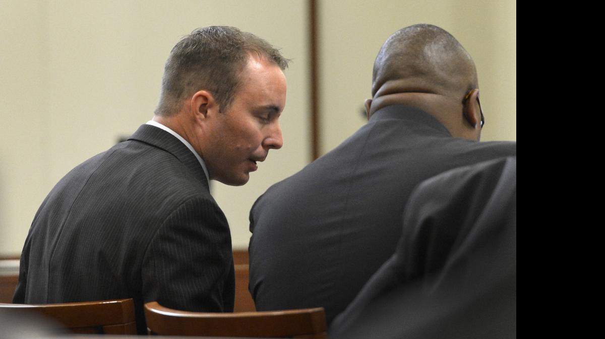 
CMPD officer Randall "Wes" Kerrick with attorney Michael Greene during the first day of his trial for killing Jonathan Ferrell, July 20, 2015. 
