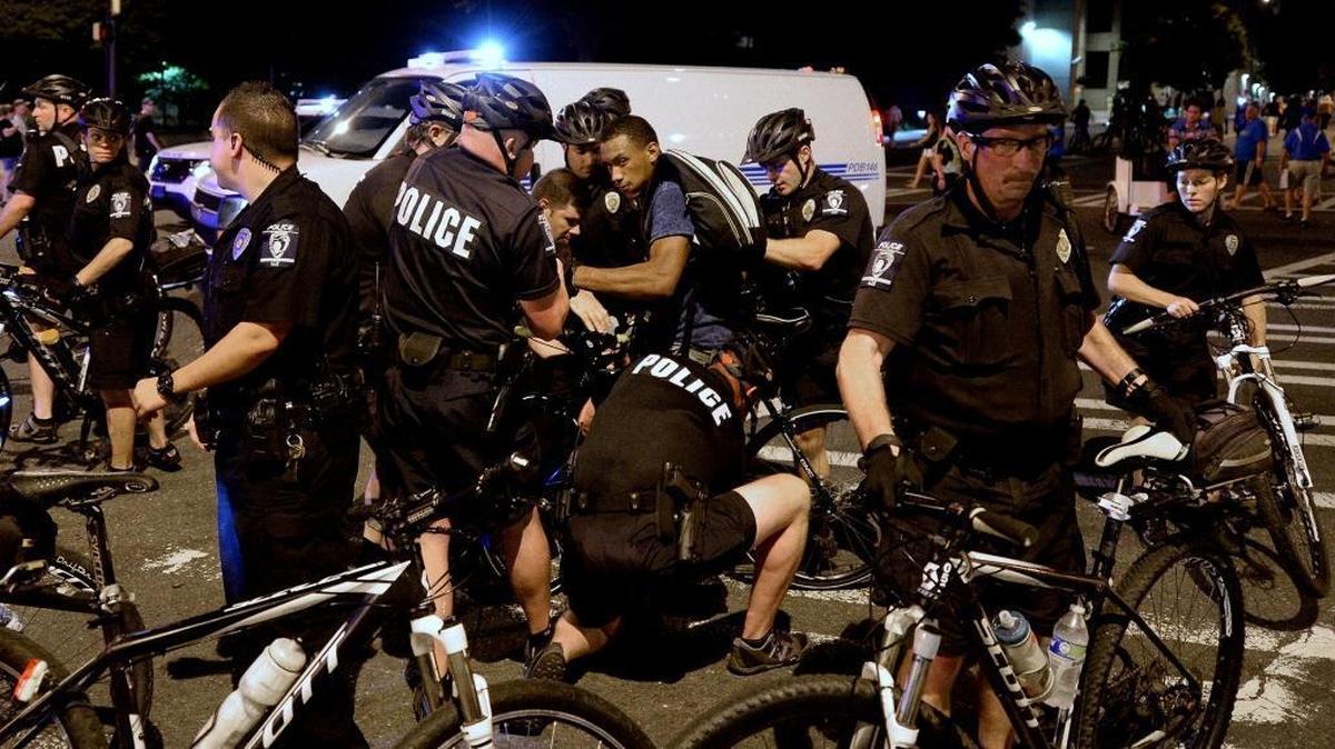
A protester is arrested by Charlotte-Mecklenburg police officers near Bank of America Stadium on Saturday. Two nights of protests followed a mistrial in the case of Randall "Wes" Kerrick. The Charlotte-Mecklenburg police officer was accused of killing Jonathan Ferrell in a struggle two years ago.
