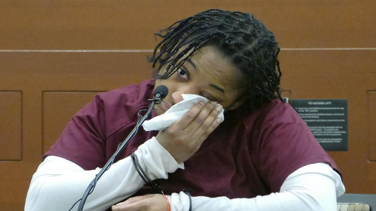 Krishay Mouzon wipes away tears as she testifies Monday, March 21, 2016, in the murder trial of her boyfriend, Todd Boderick, who is accused of viciously beating her daughter, 6 month old, Keyoni to death.