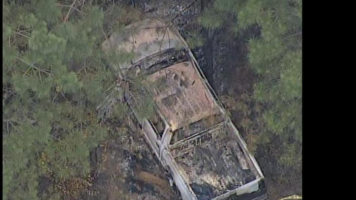 
The burned-out truck in western York County where two men’s bodies were found Friday.
