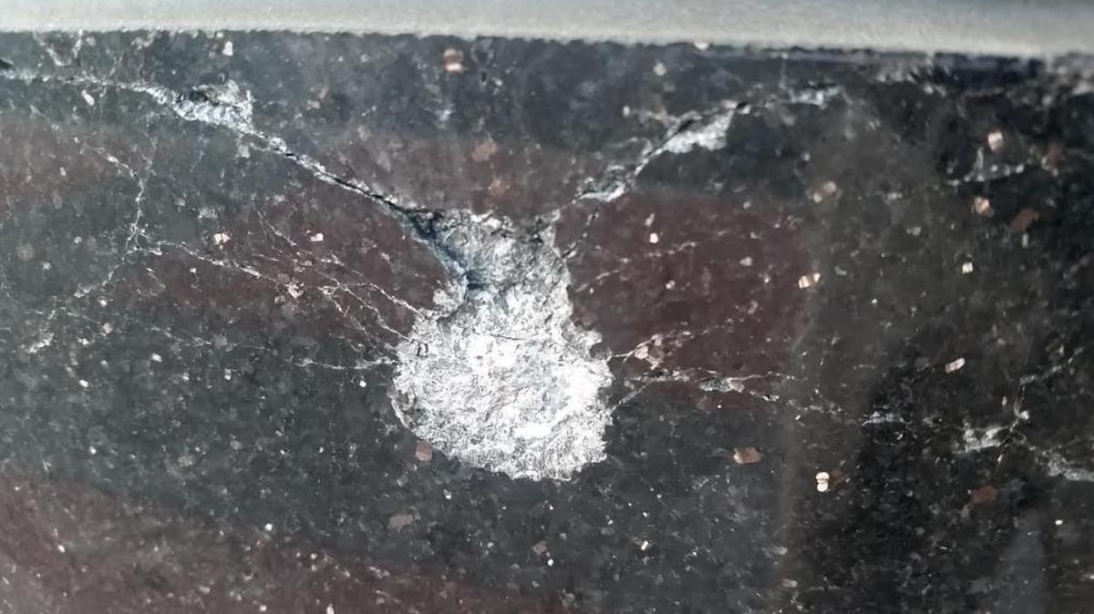 Bullets created marks in the entrance to the Skye Condominiums.