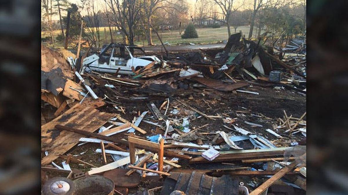 The driver charged in a crash that sparked a house explosion that killed an elderly Cleveland County couple in February is in custody.