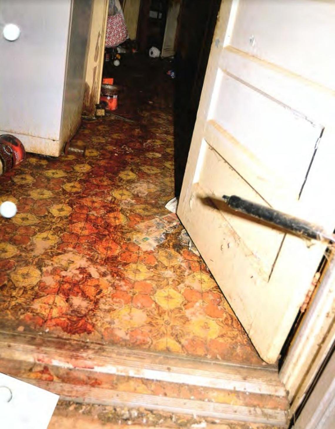 A trail of blood leads from John Clark’s bedroom after he was shot to death in December 2014 in Morganton. Federal documents say ISIS convert Justin Sullivan killed his neighbor while he slept in his bedroom.