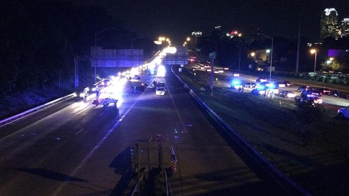 Police arrested a Charlotte man they said left the scene after driving over an injured motorcyclist on Brookshire Boulevard near Interstate 77 Thursday night.