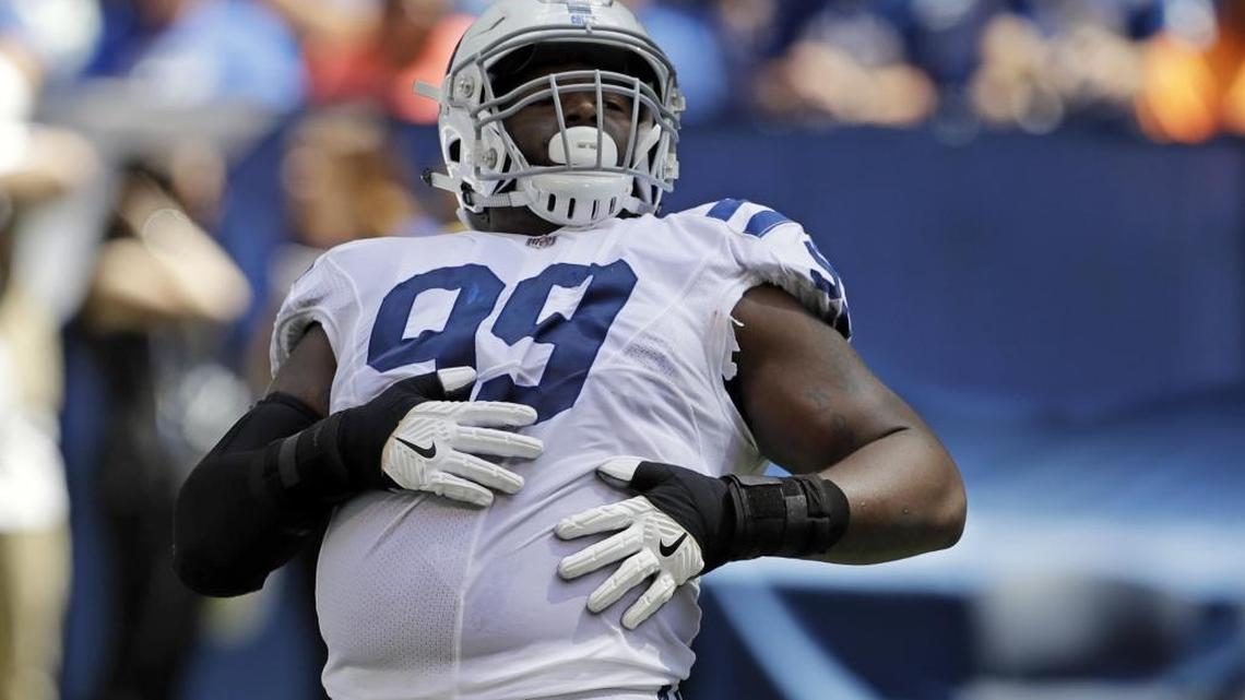 Former Indianapolis Colts defensive tackle T.Y. McGill celebrates after a play against the Detroit Lions during the first half of a preseason game on Aug. 13 in Indianapolis. McGill, who was charged with possession of marijuana over the weekend, was claimed by the Cleveland Browns off waivers Sunday.